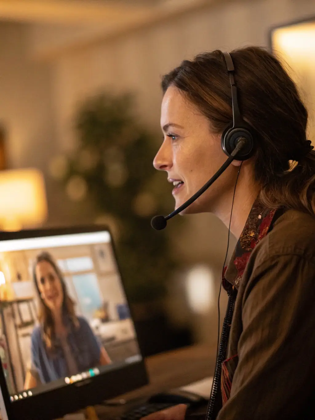 An AI virtual assistant making an outbound call with a headset on, representing outbound call campaigns.